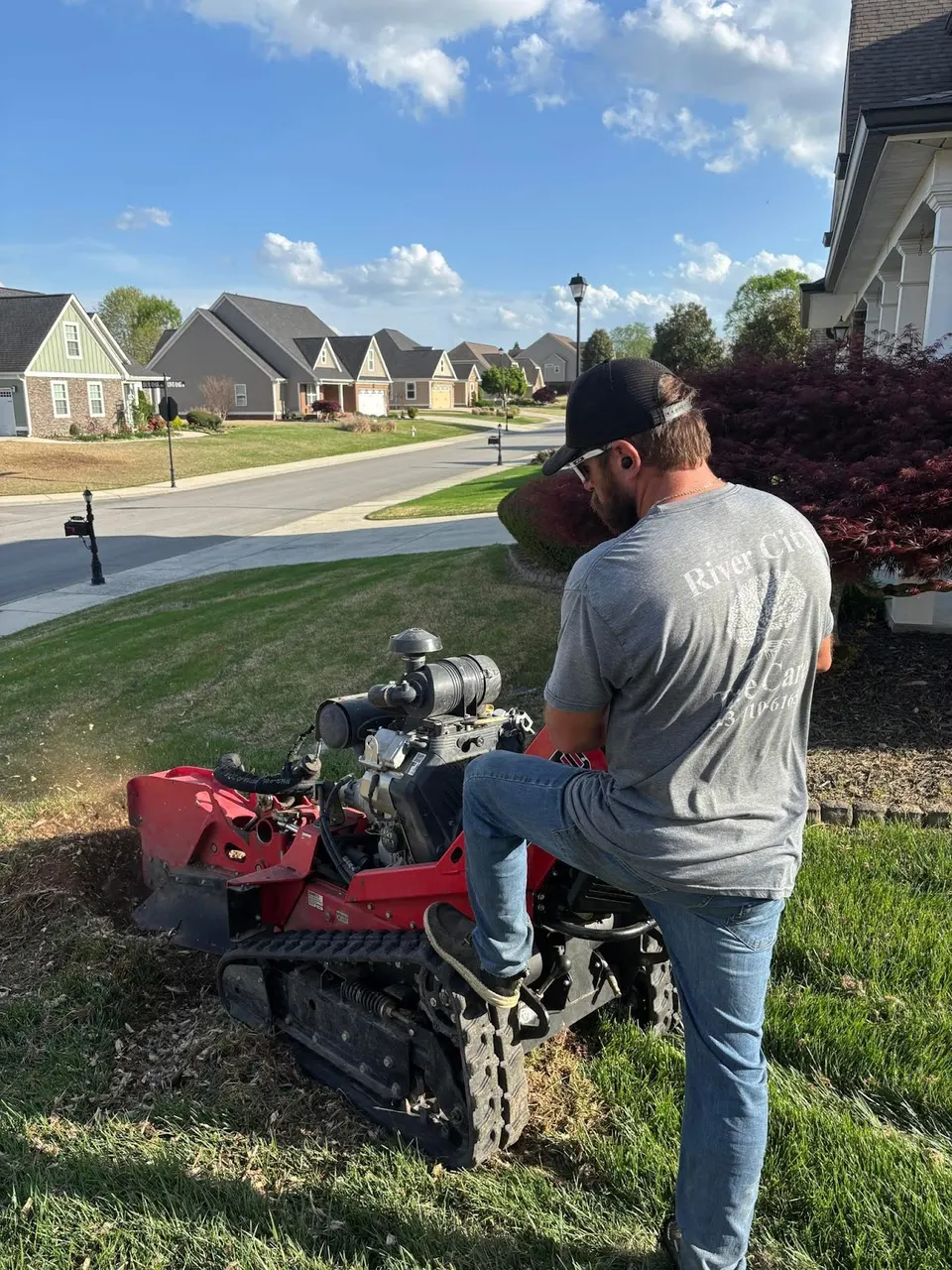 Commercial stump grinder removing stump below grade