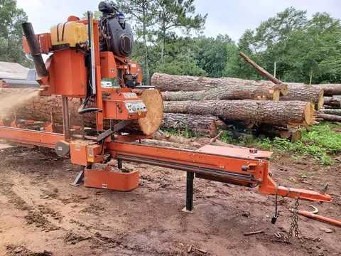Logs ready for portable sawmill processing — custom lumber milling